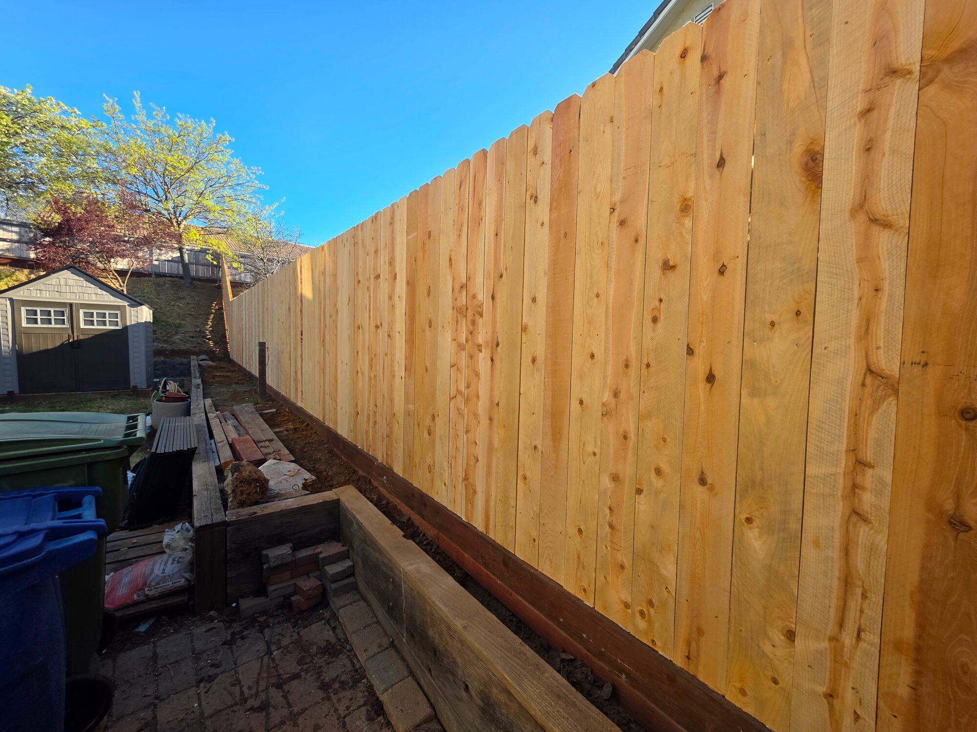 New cedar fence installation