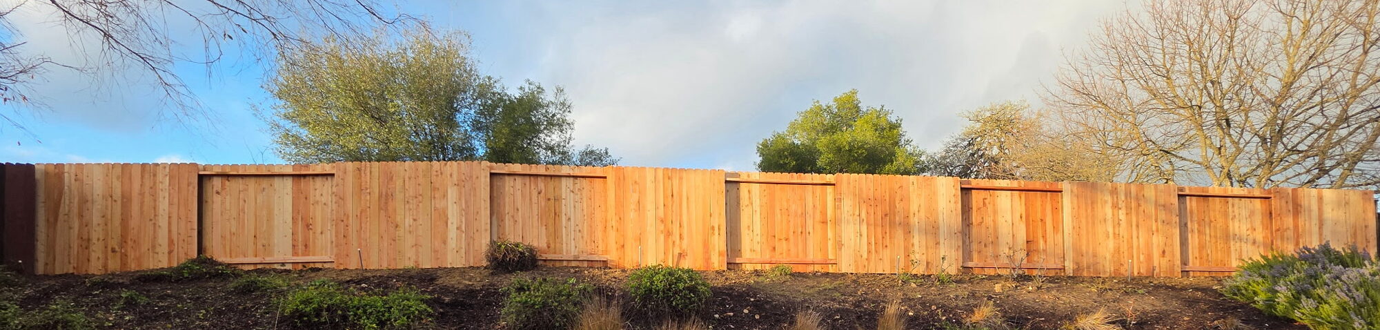 Wood fence with recessed panel sections